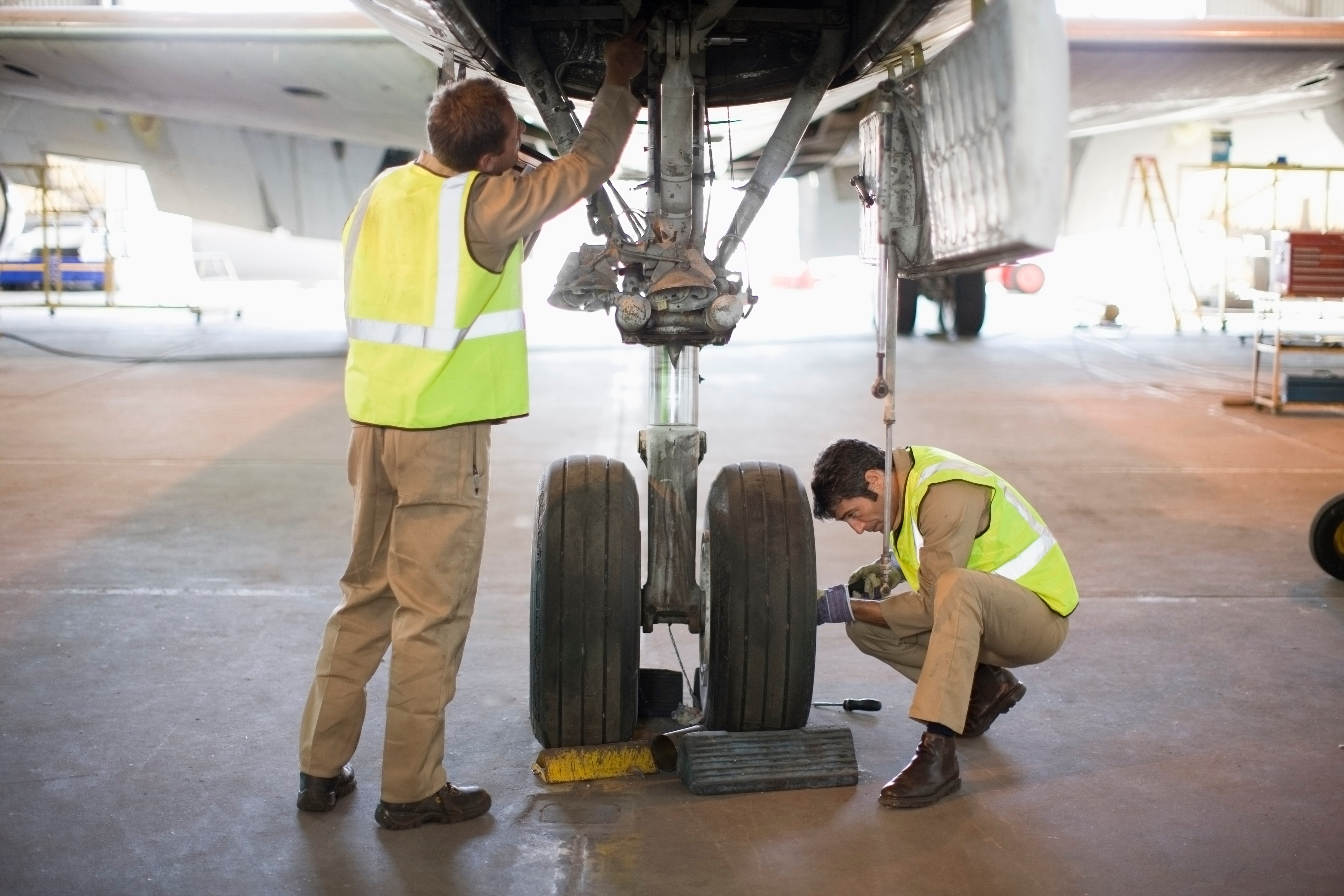 Aircraft workers checking wheels 2023 11 27 05 21 24 utc
